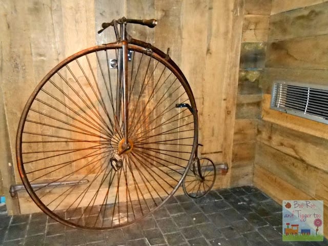 A bicycle parked on the side of a building