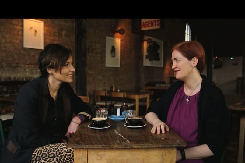 Emma Donoghue et al. sitting on a kitchen counter