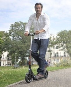 A man riding a skateboard up the side of a road