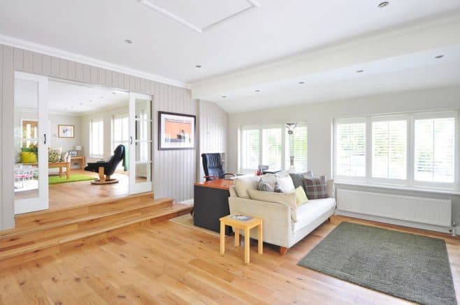 A living room filled with furniture and a large window