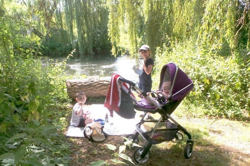 A person sitting on a bench in a park