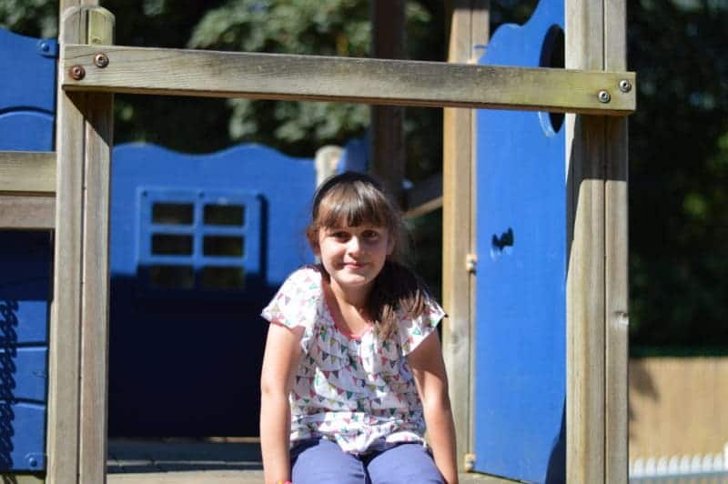 A girl sitting on a bench