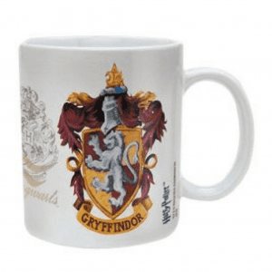 A glass mug on a table, with Harry Potter