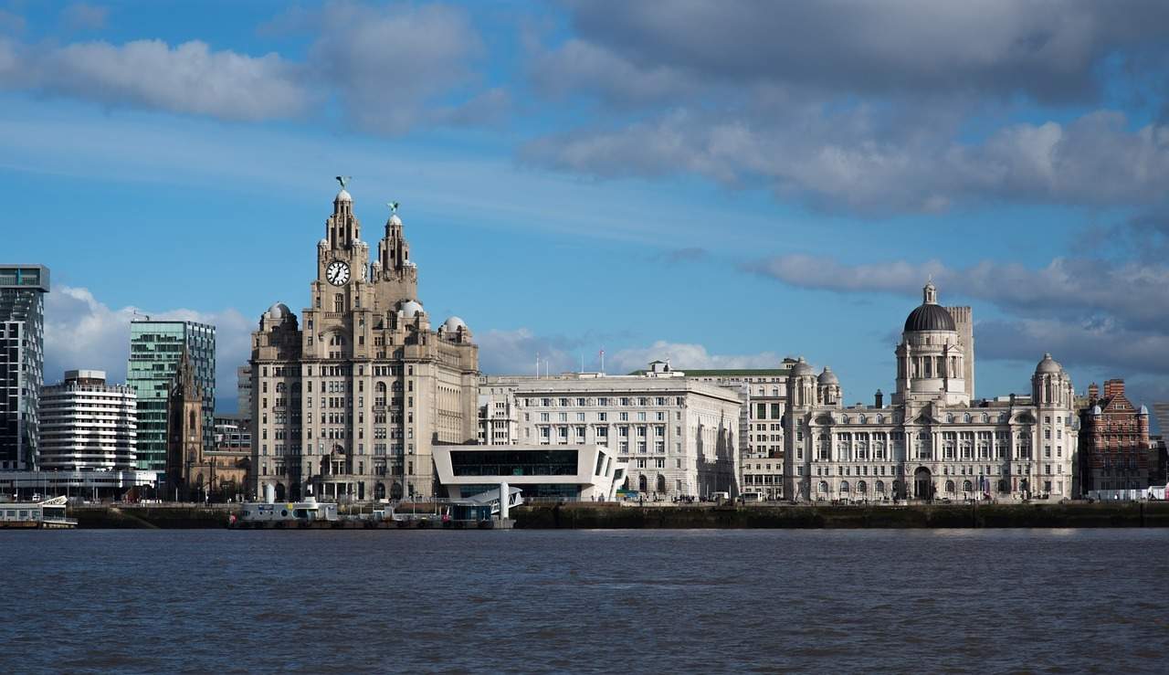 A large body of water with a city in the background