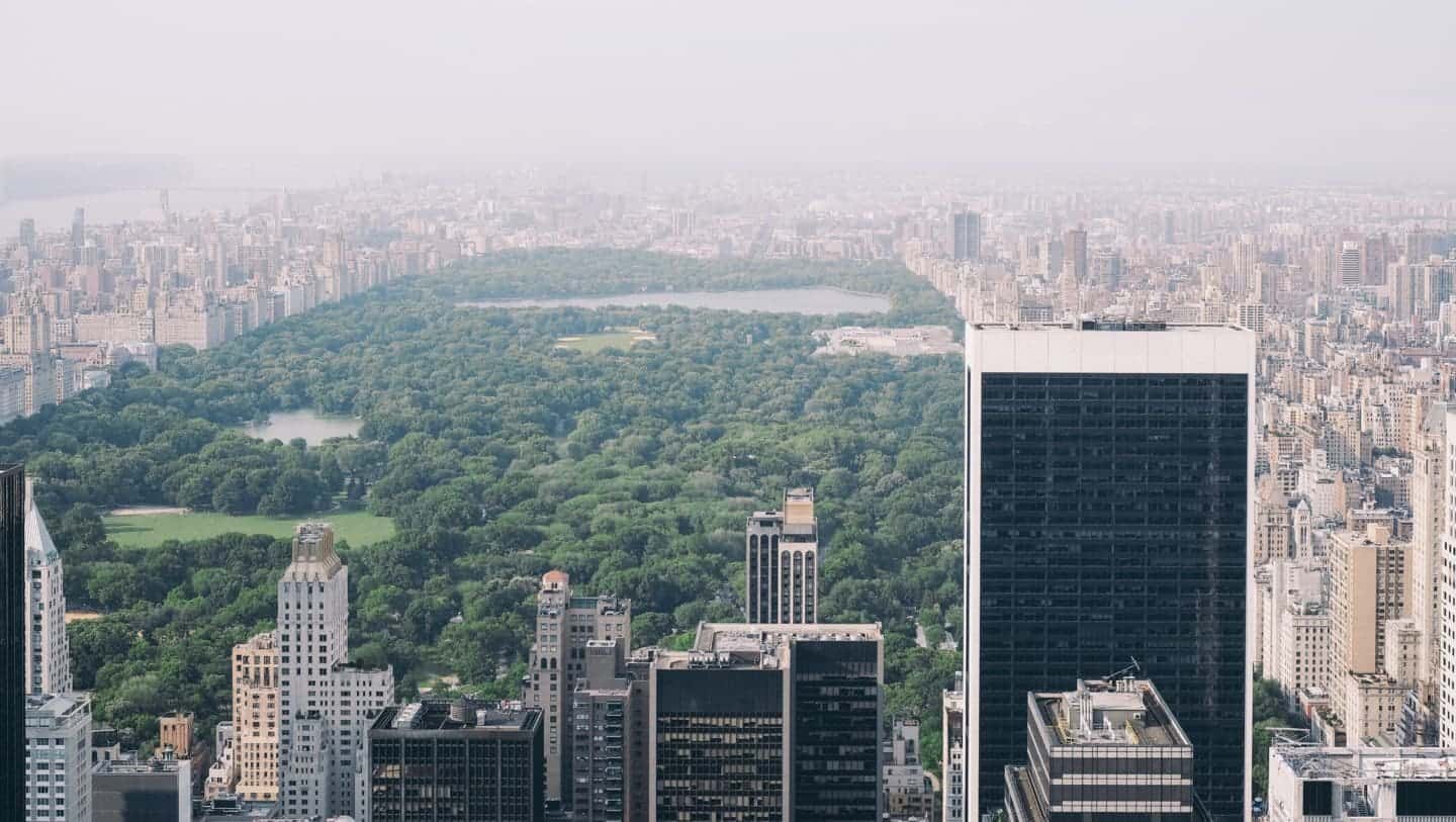 A view of 30 Rockefeller Plaza with tall buildings in the background