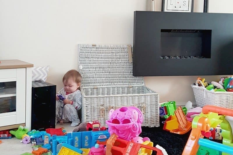 A small child sitting on a table