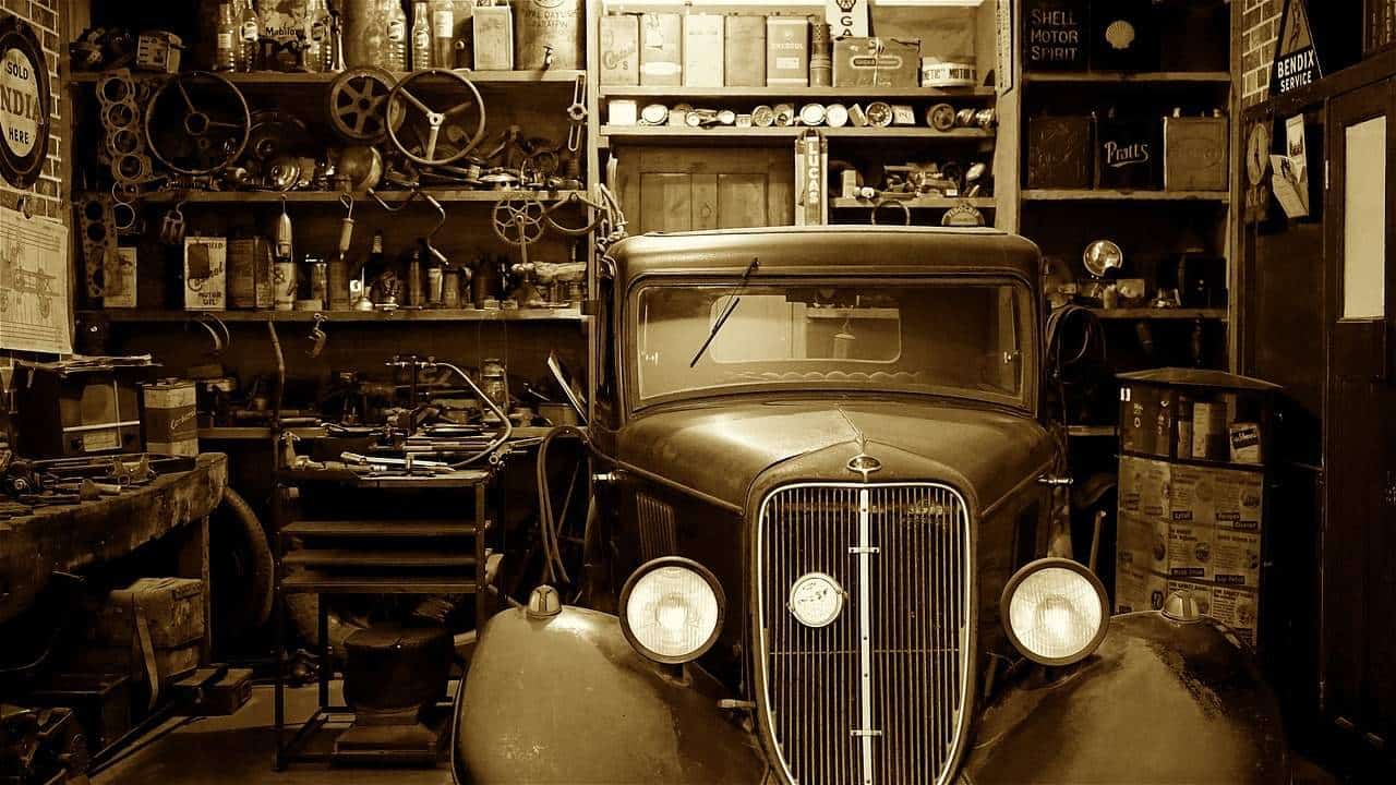 A vintage photo of an old car on display