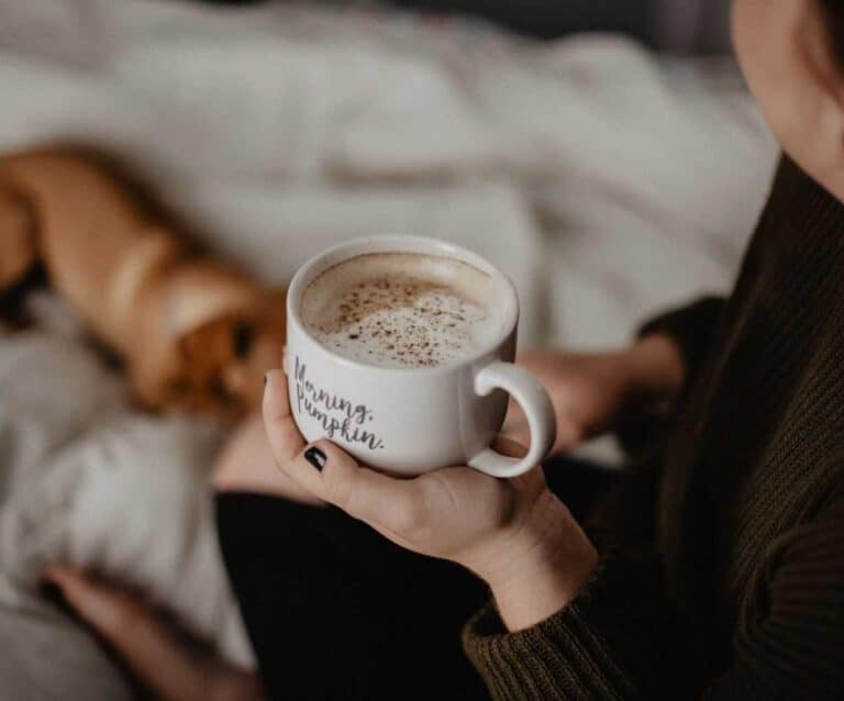 A person drinking from a coffee cup