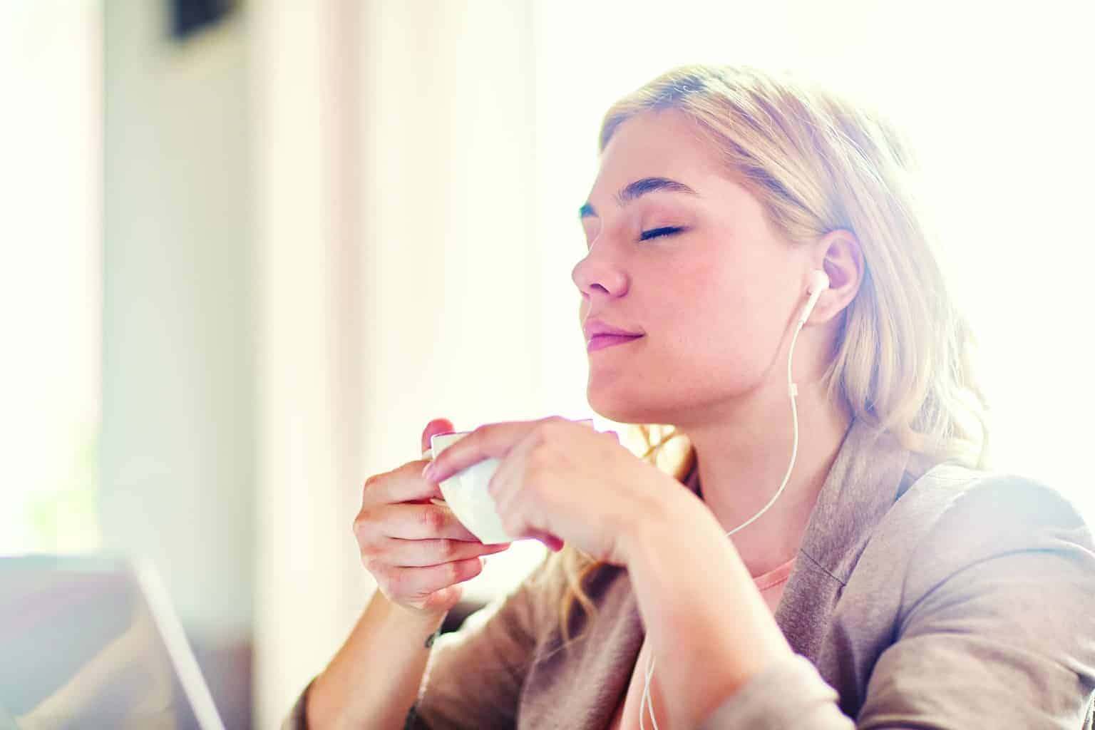 A woman eating a donut