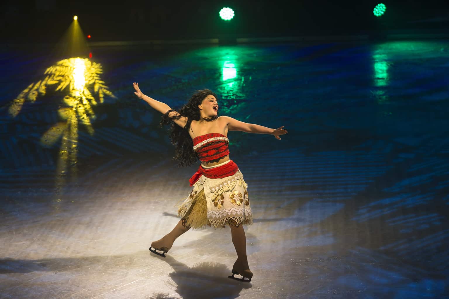 A person standing next to a body of water, with Mickey Mouse