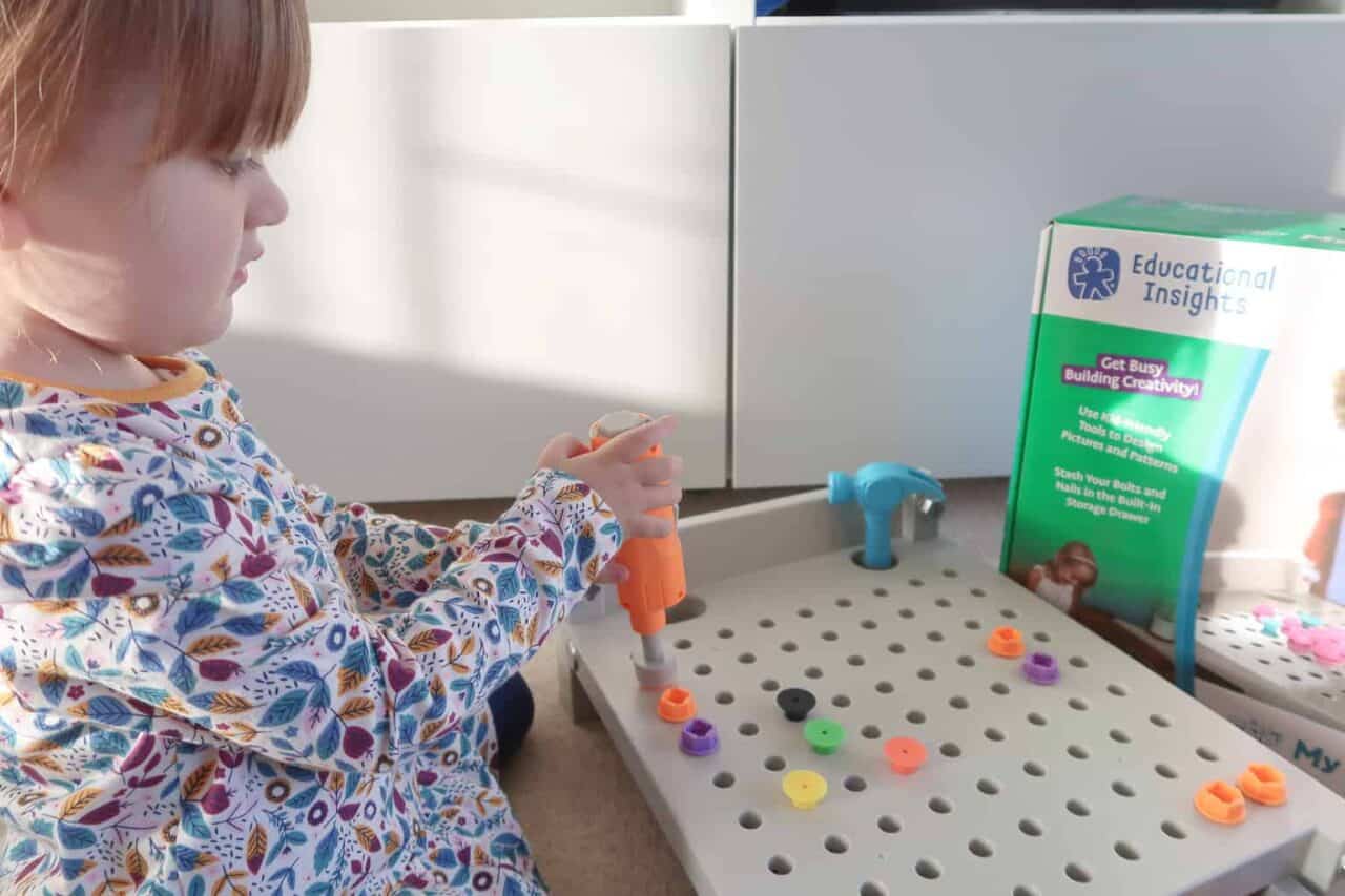 A small child sitting on a table