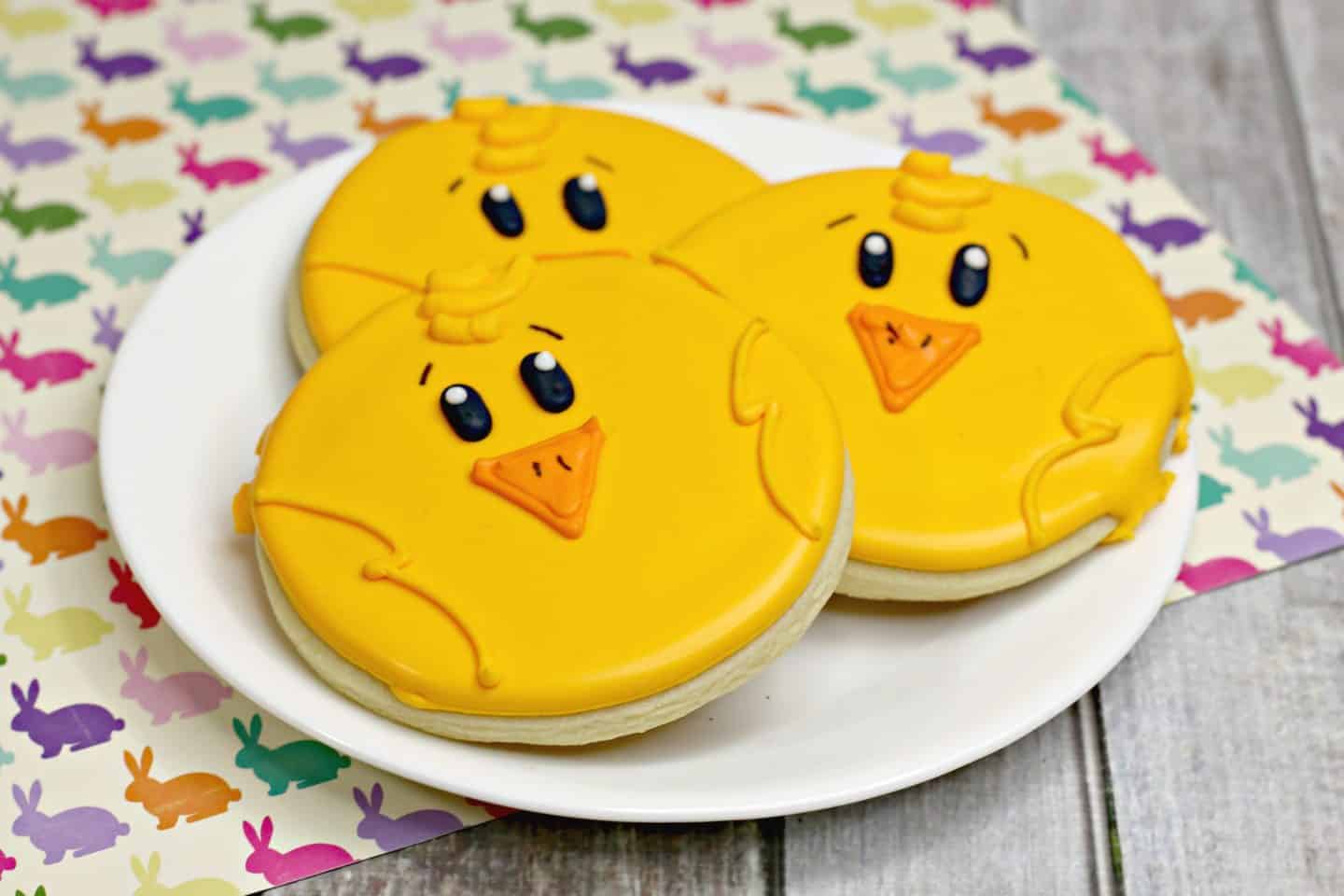 A plate of birthday cake on a table, with Cookie and Sugar