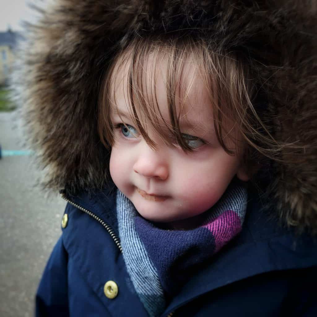 A little girl in a blue shirt