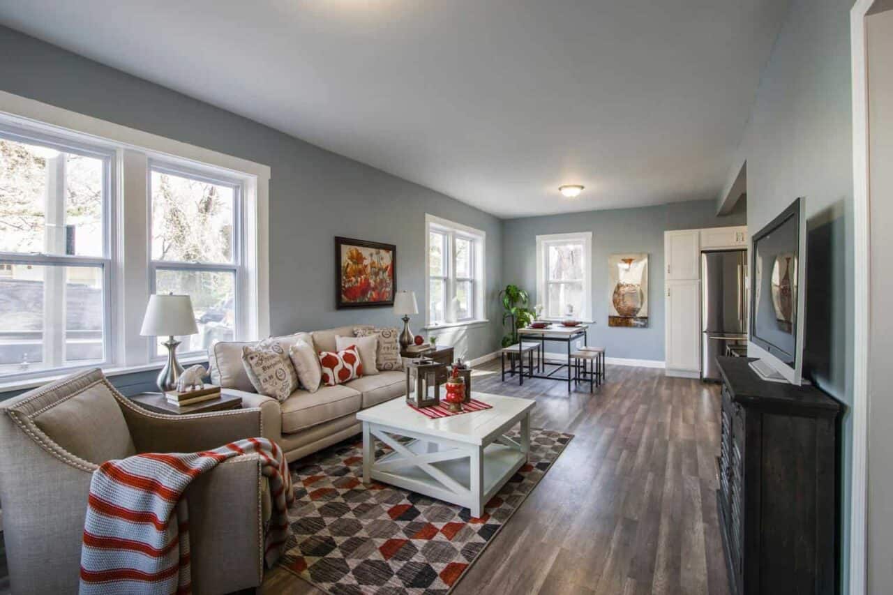 A living room filled with furniture and a large window