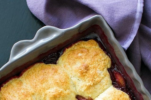 A close up of food, with Plum and Cake