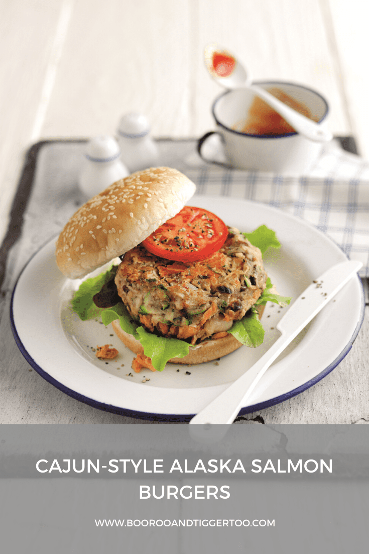 A plate of food on a table, with Salmon and Salmon burger