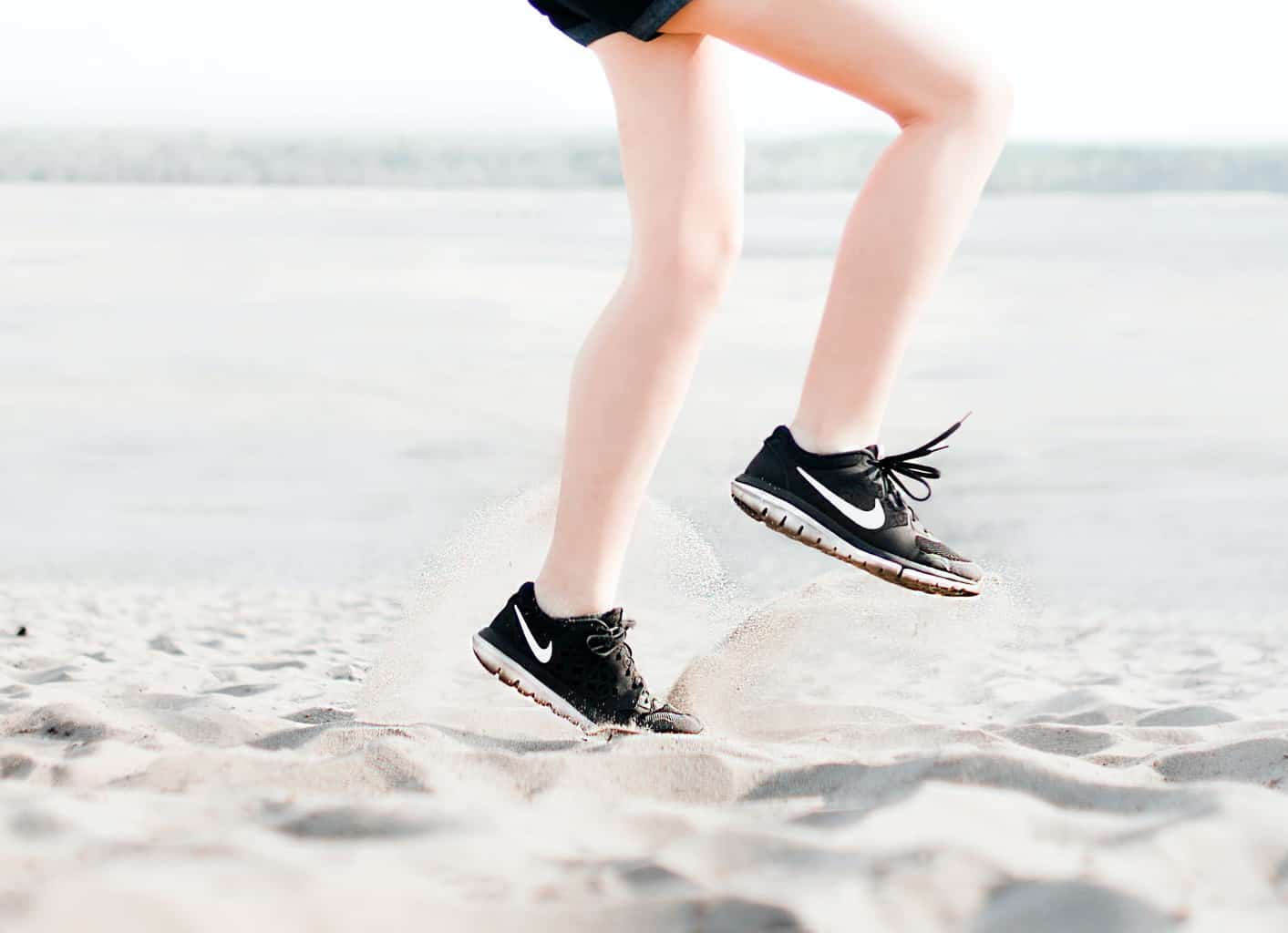 Fitness Goals: Tips To Help You Stay On Track | photo of a woman wearing pair of black Nike running shoes