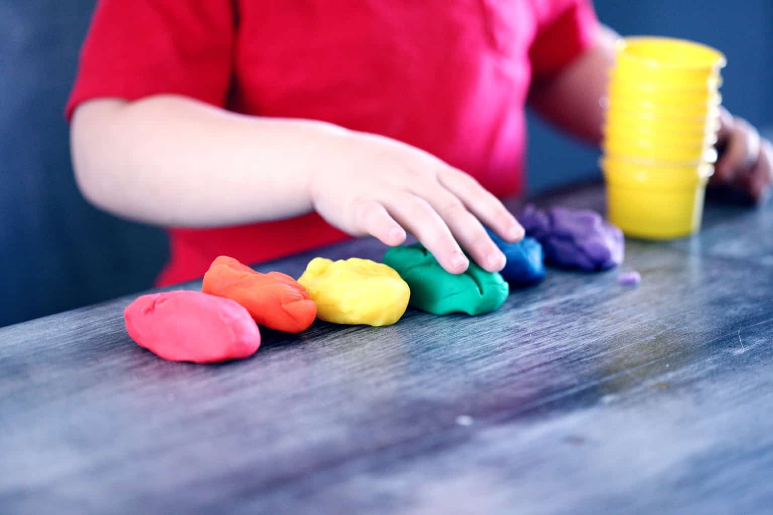 Signs Your Child Might Have Lead Poisoning | person making clay figures