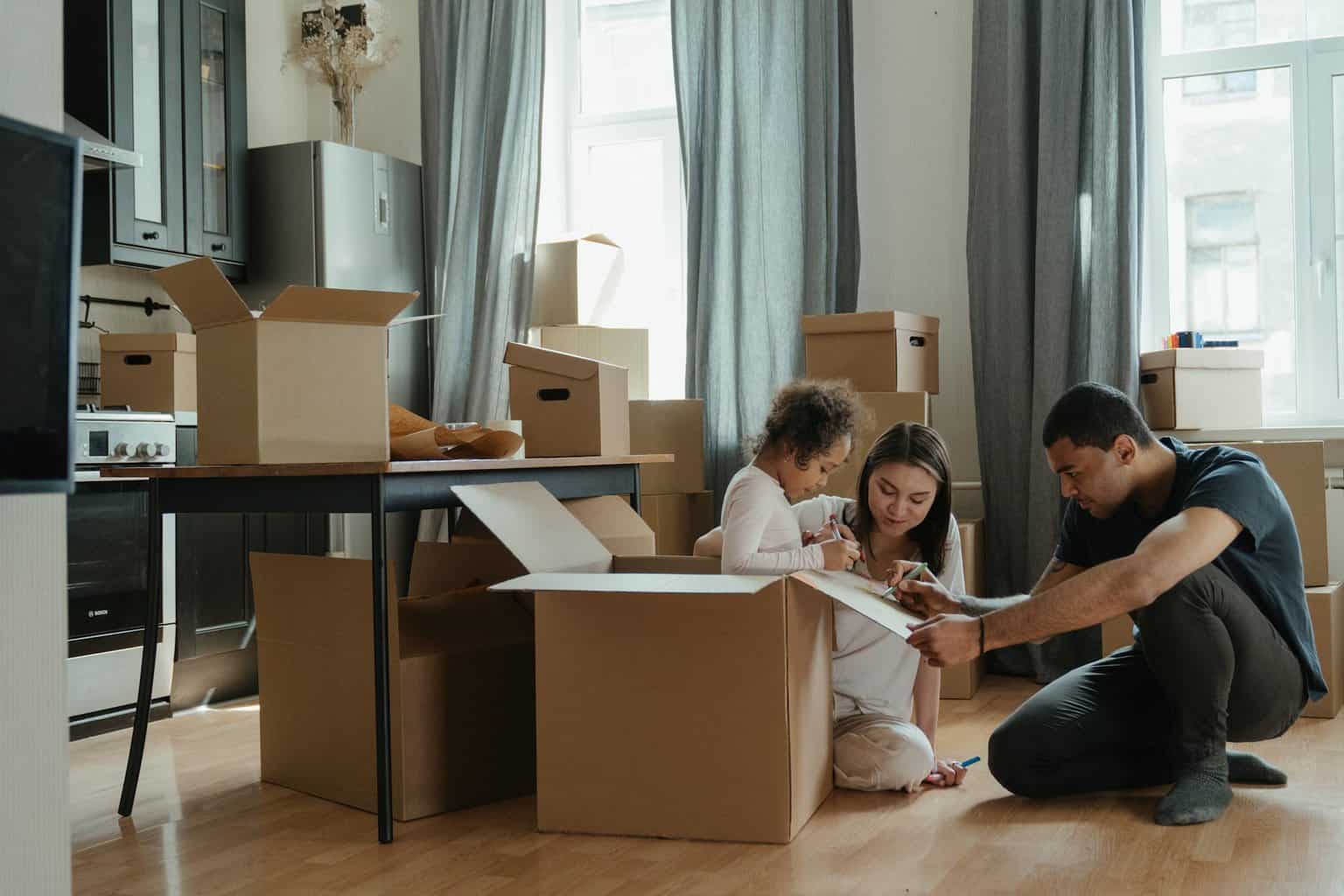 You Can't Move Home Without Doing These Things First - family unpacking after moving