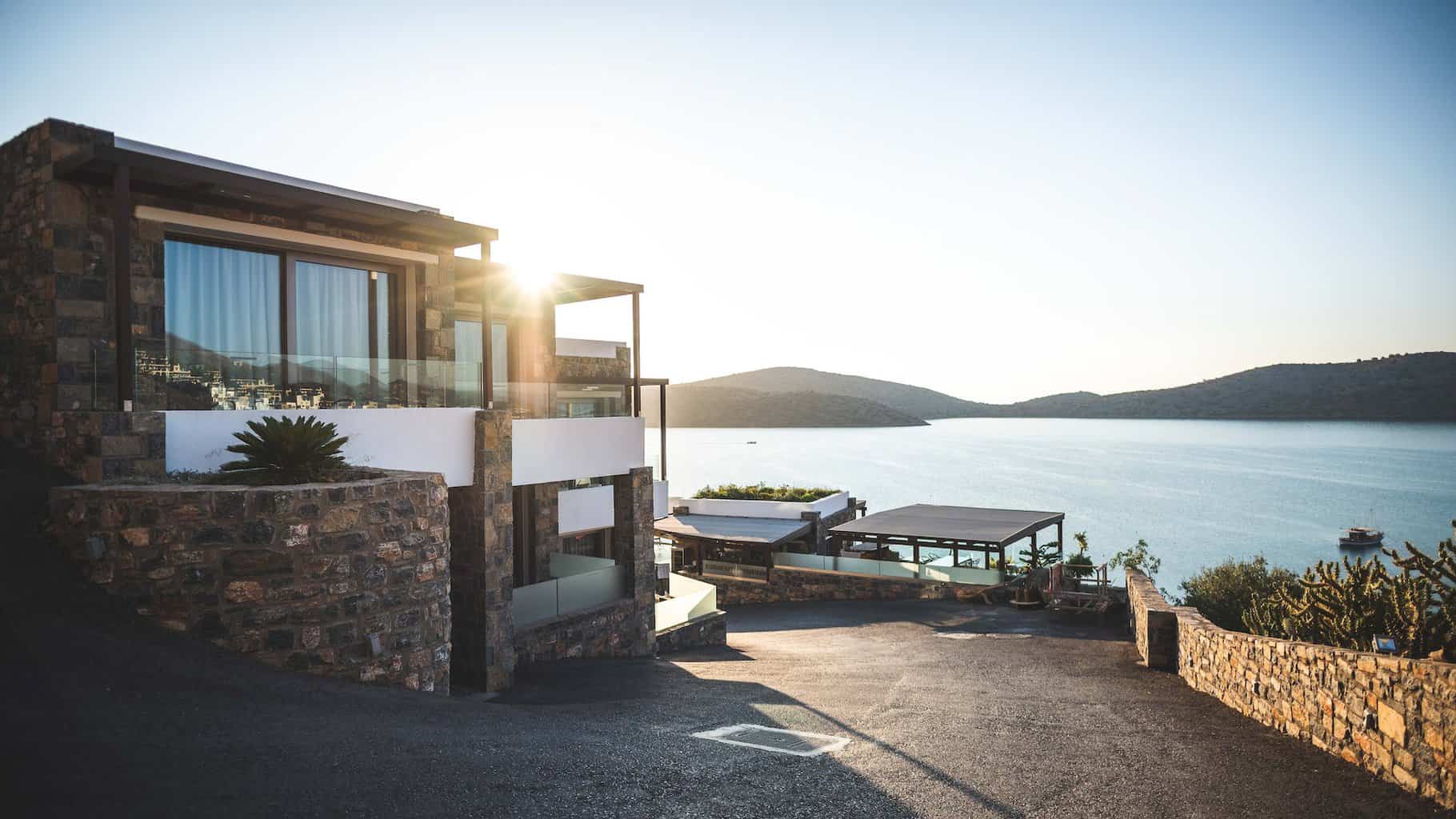 sun piercing of brown concrete house near sea - Short-Term Goals Are Good But What About The Future?