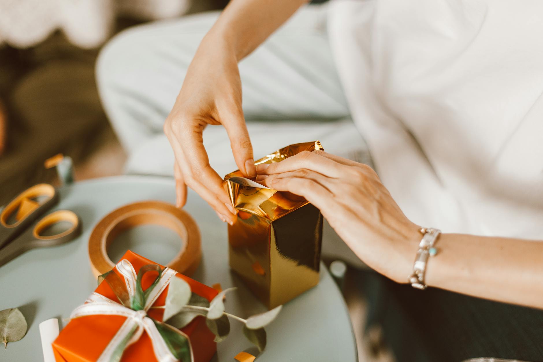 woman wrapping presents boxes