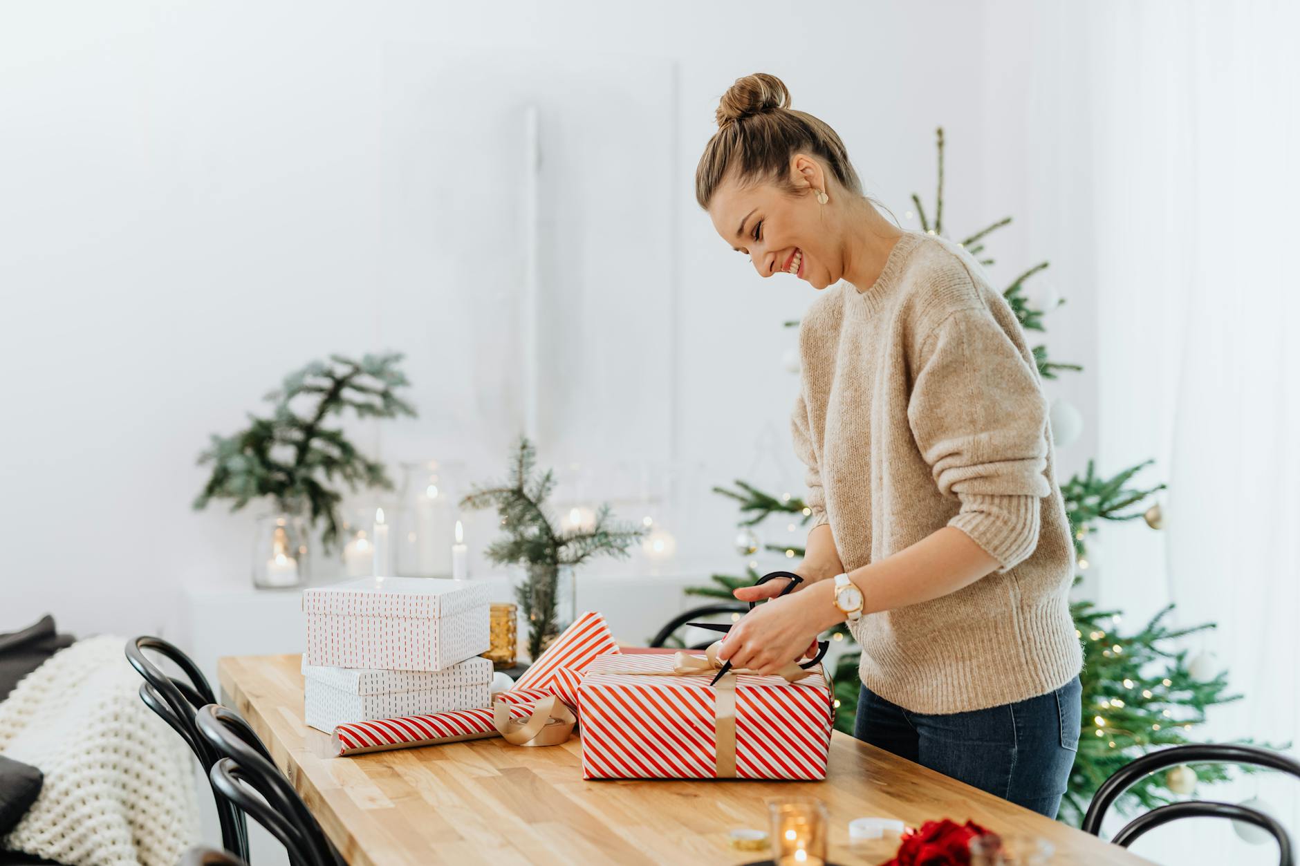 a woman opening a christmas present